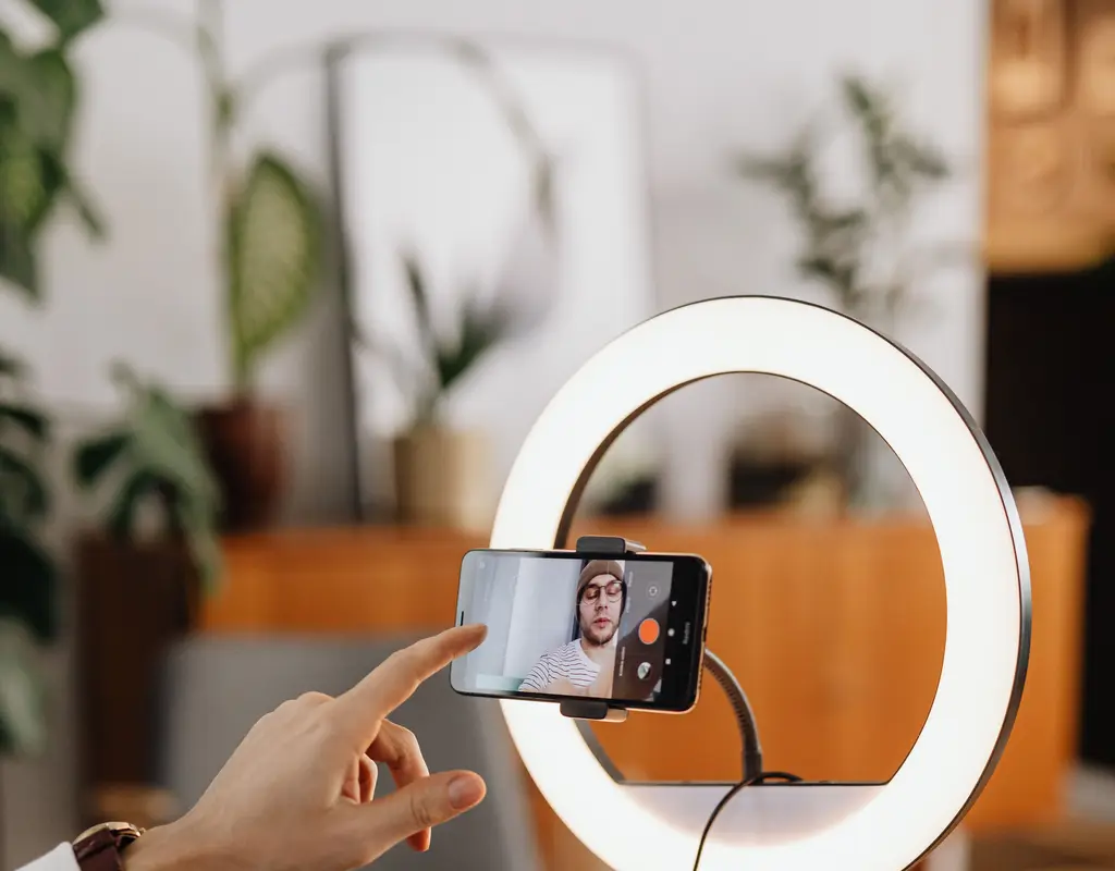 Ring light illuminating a smartphone during a video call setup