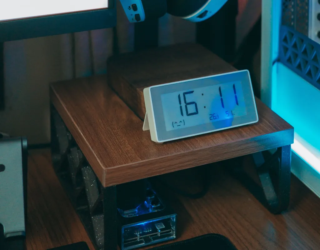 Compact desk clock with date and temperature display for a small home office