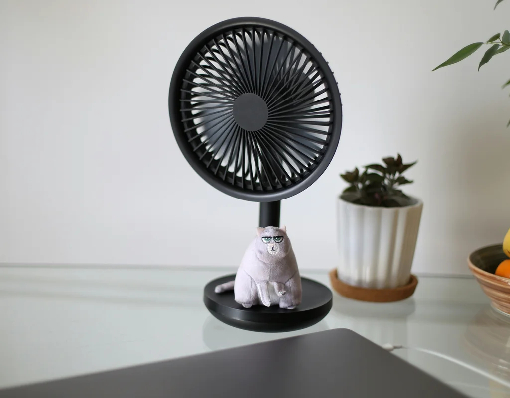Compact desk fan with adjustable speeds for a small home office
