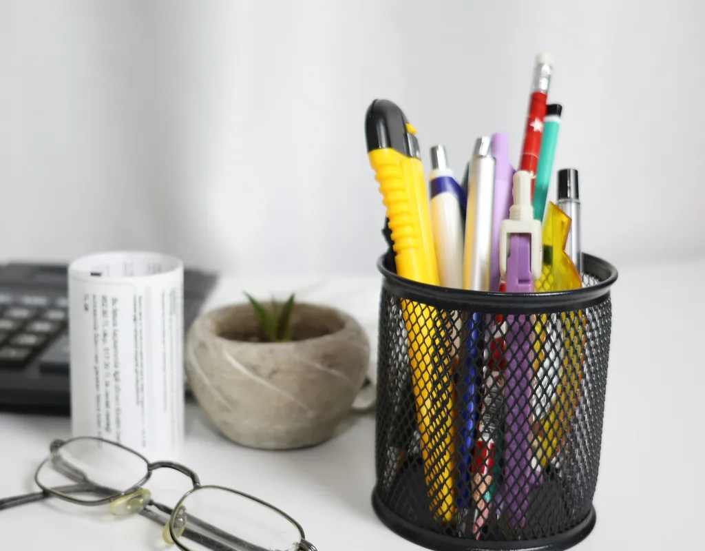 Compact pen and accessory organizer on a small home office desk