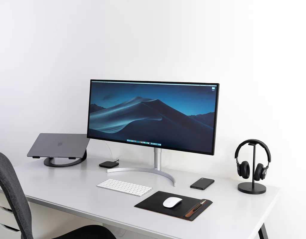 desk positioned away from noise sources in a small home office