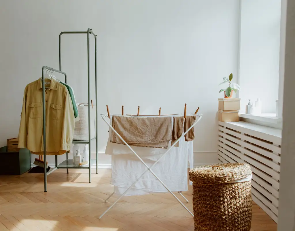 Foldable drying rack in a small apartment laundry area