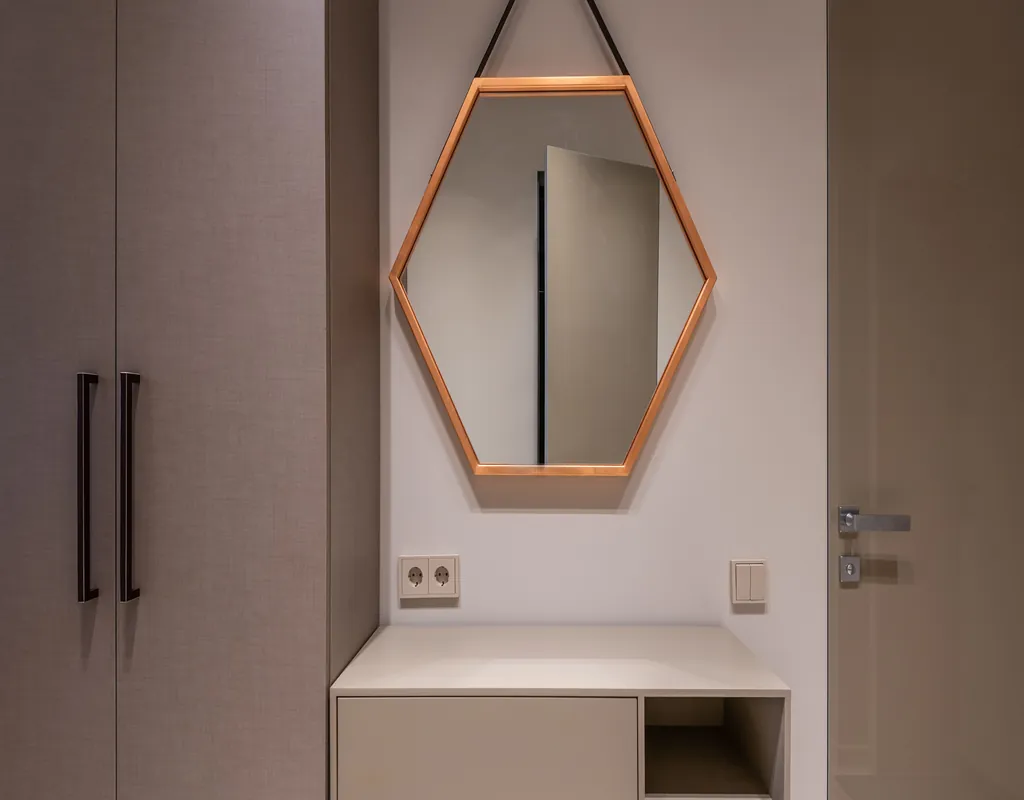 Tall mirror in a small narrow entryway