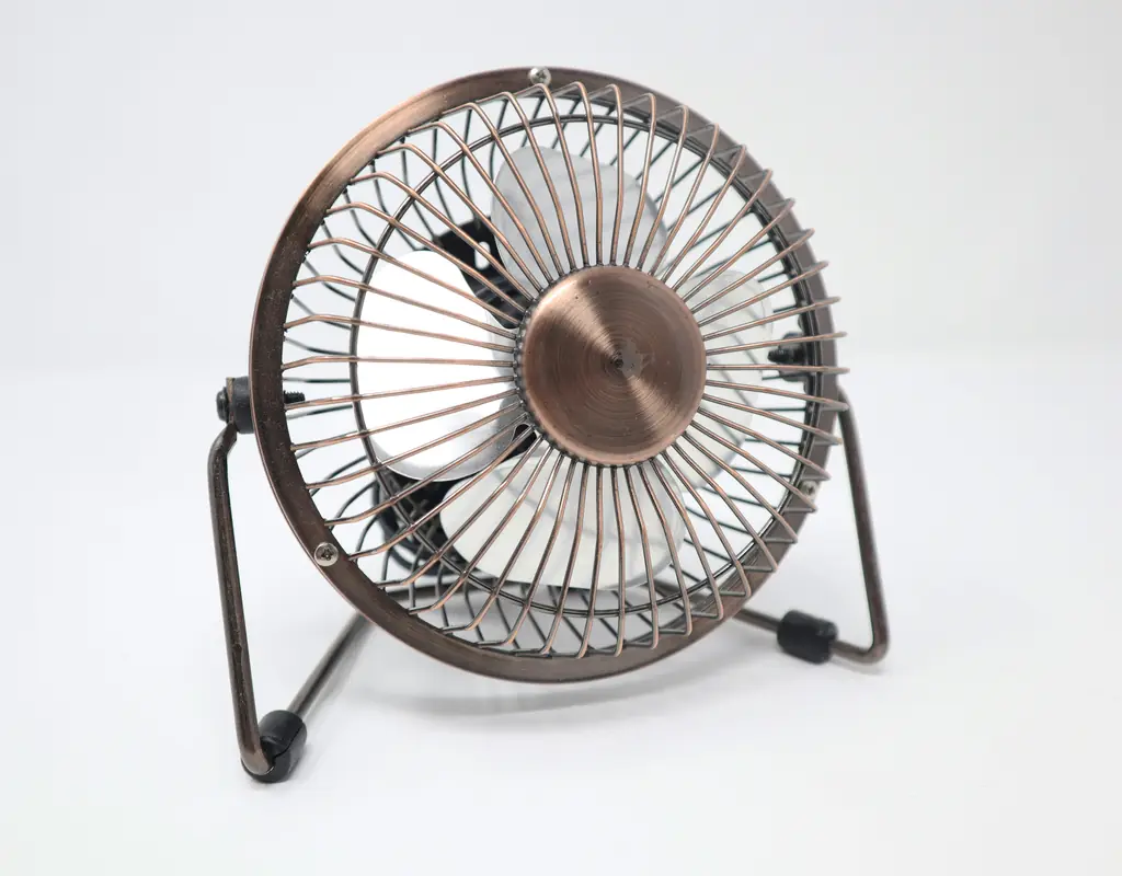 Mini USB desk fan on a small home office desk