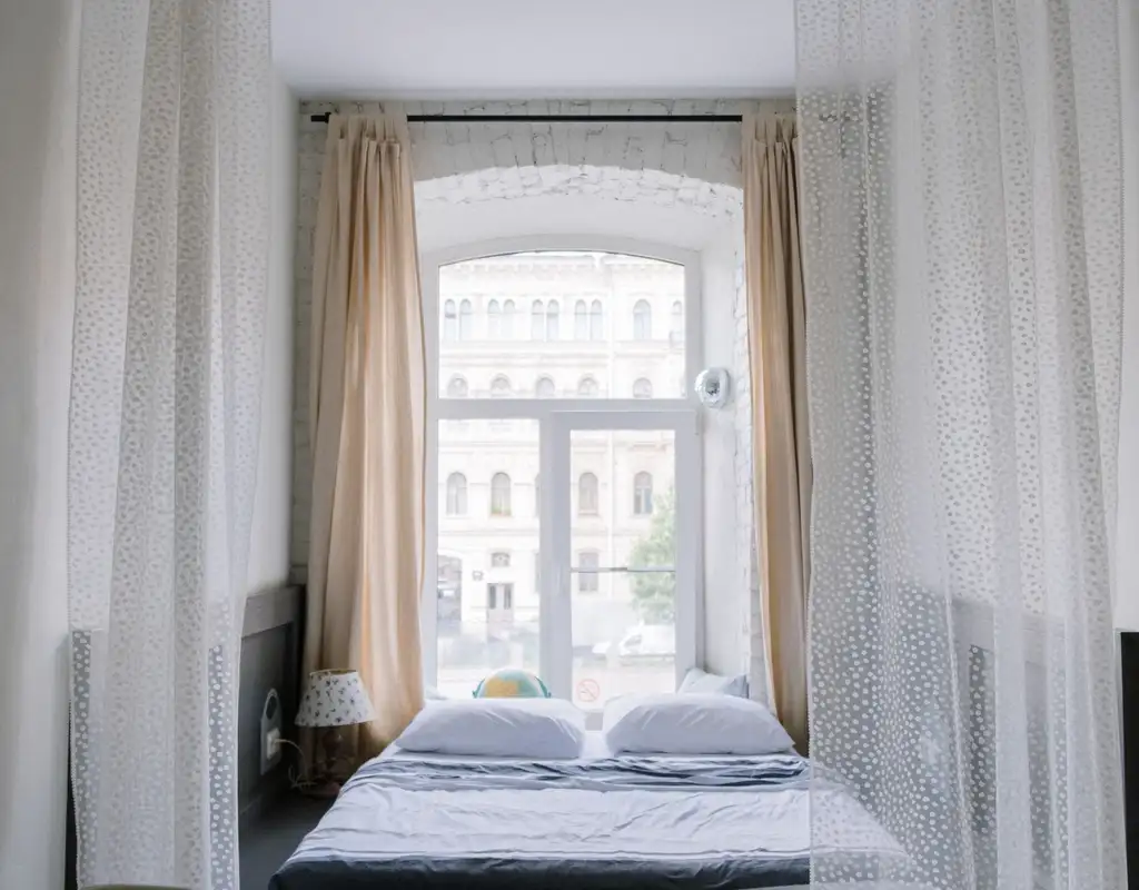 Small bedroom with natural light through a window