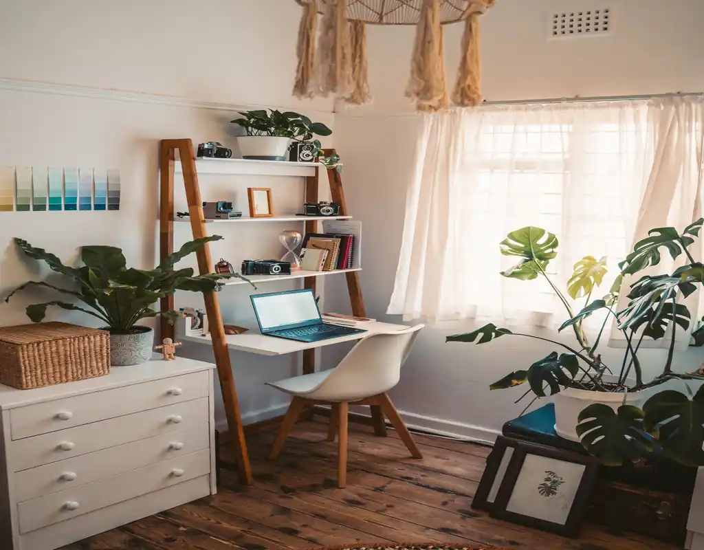Small home office with a compact desk, chair, clear walkway, and organized layout